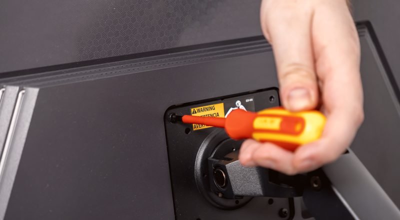 Technician setting up a television